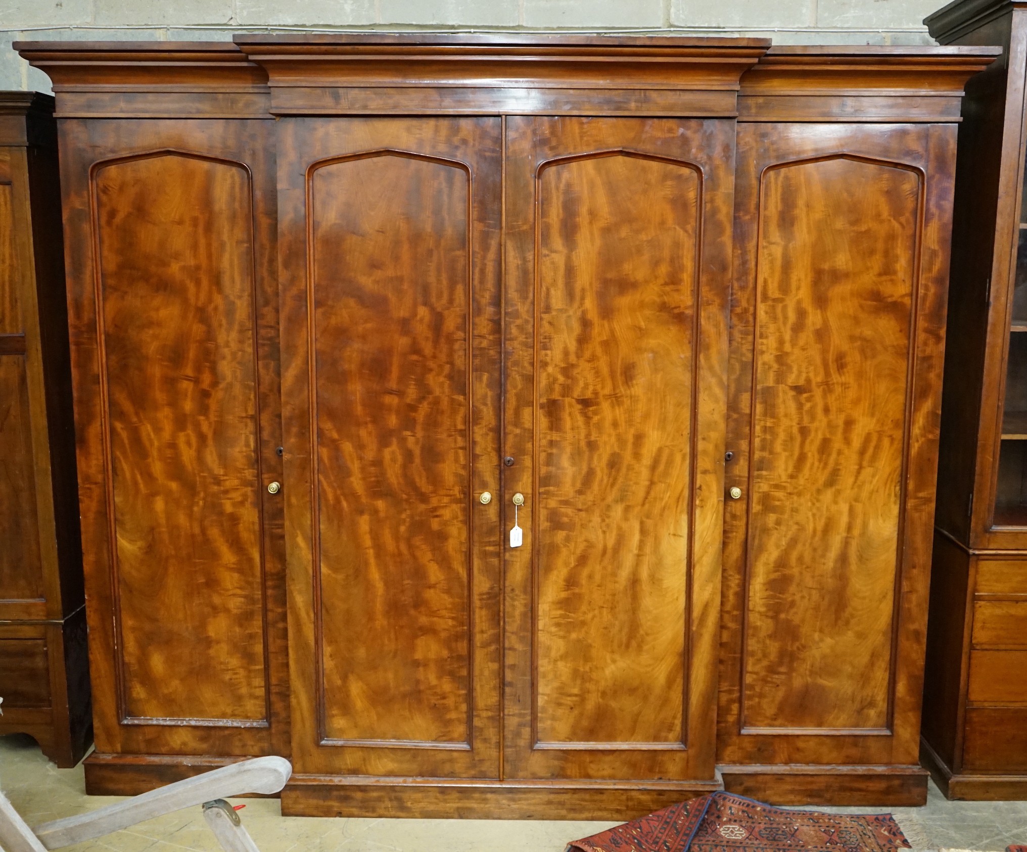 A Victorian mahogany breakfront compactum wardrobe, width 248cm, depth 69cm, height 210cm